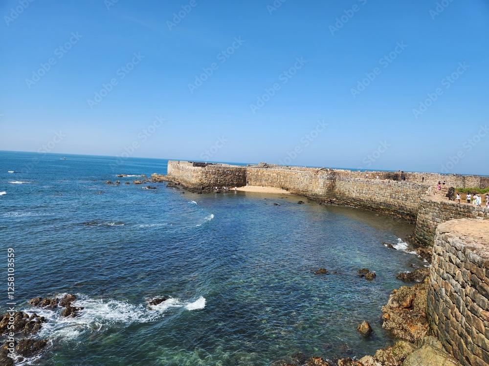 Malvan, Maharashtra India - January 28 2025: Sindhudurg Fort is a historical sea fort located in Arabian Sea near the Konkan region of Maharashtra in Western India. Malvan, Maharashtra India - January 28 2025: Sindhudurg Fort is a historical sea fort located in Arabian Sea near the Konkan region of Maharashtra in Western India.