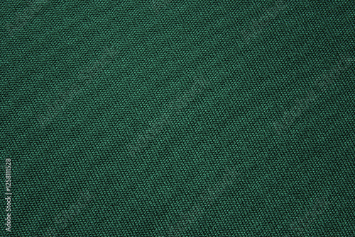 Dark green fine cotton jersey fabric texture as background