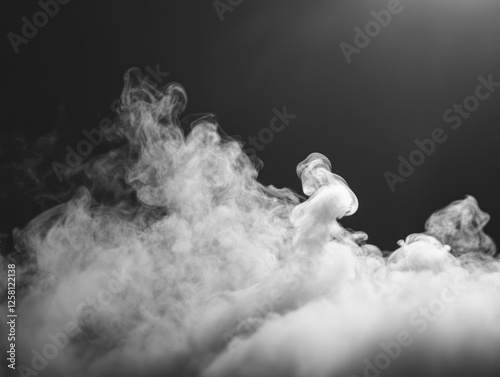 Vapor or smoke rising from a source, possibly due to heat or combustion. photo