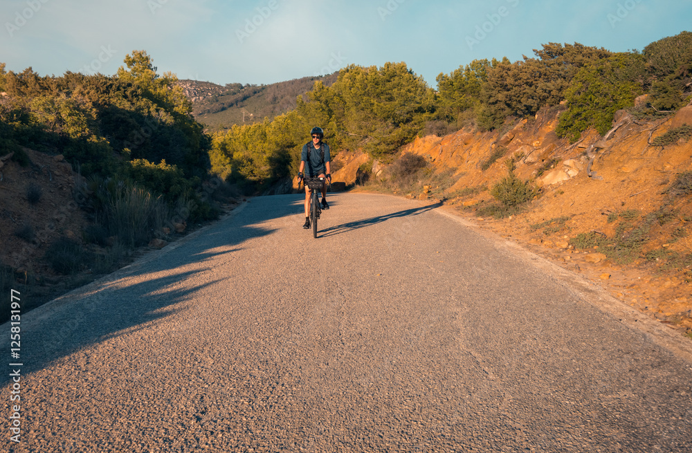 Cyclist riding downhill in Zahara de los Atunes Cyclist riding downhill in Zahara de los Atunes