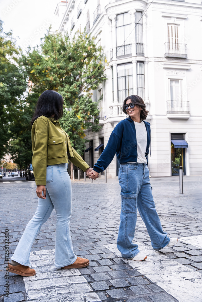 Couple walking hand in hand enjoying a city stroll