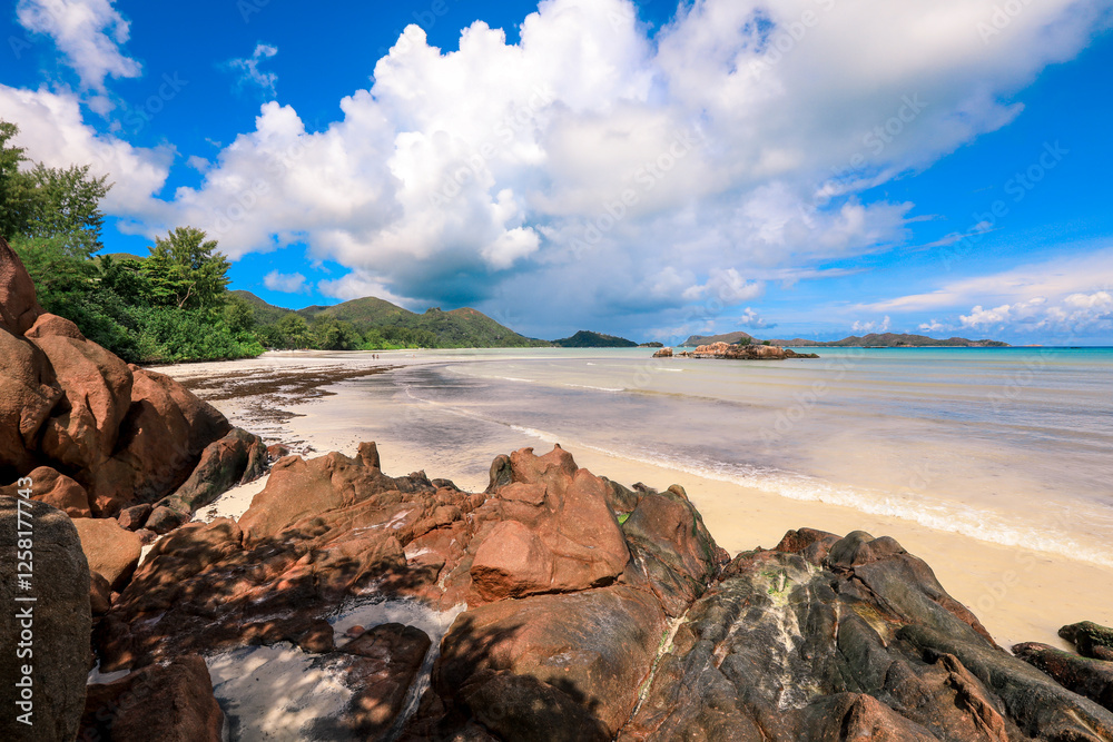 Beautiful coastlines and rocky formations on Praslin Island in Seychelles during a clear day Beautiful coastlines and rocky formations on Praslin Island in Seychelles during a clear day