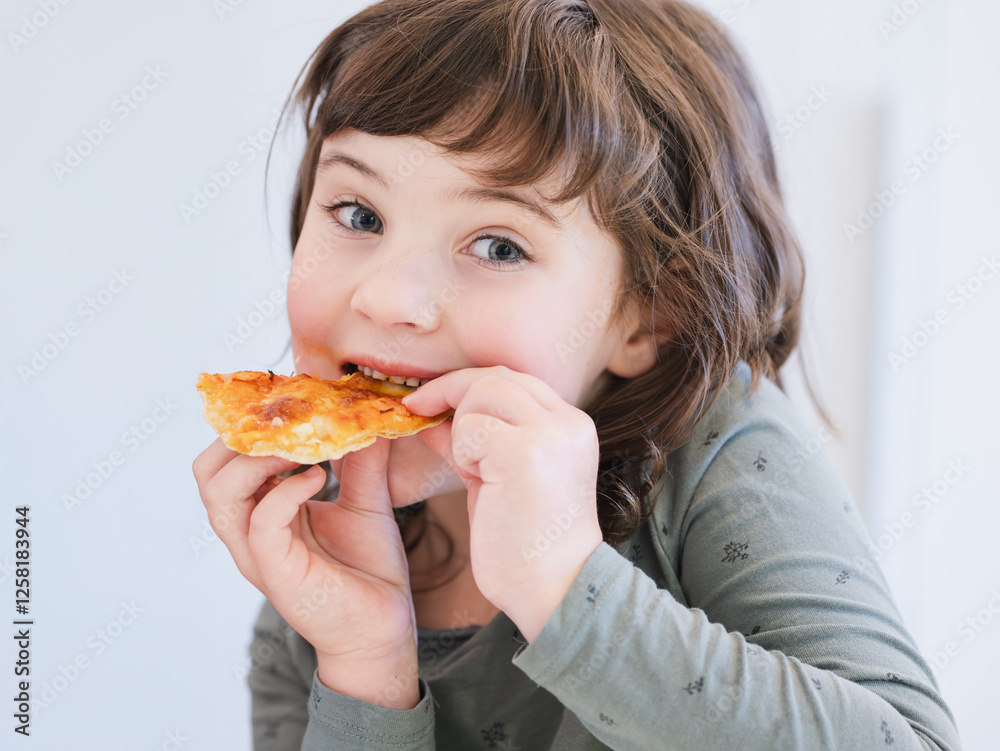 Adorable child enjoying a slice of delicious pizza Adorable child enjoying a slice of delicious pizza