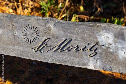 Logo of St. Moritz, Switzerland on a wooden board