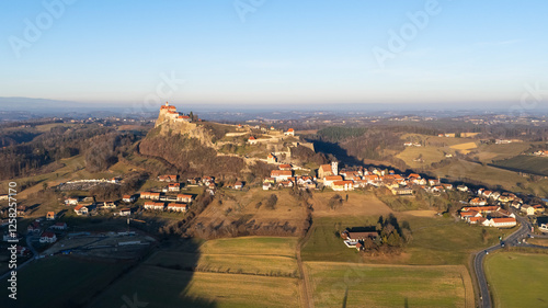 Sunset view of the medieval Regiersburg castle, a famous landmark and tourist spot in Austria photo