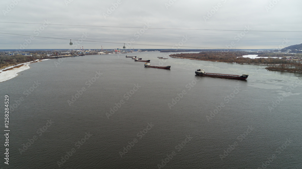 Large body of water with several large ships floating on it. Frozen channels of the great Russian Volga River. Large body of water with several large ships floating on it. Frozen channels of the great Russian Volga River.