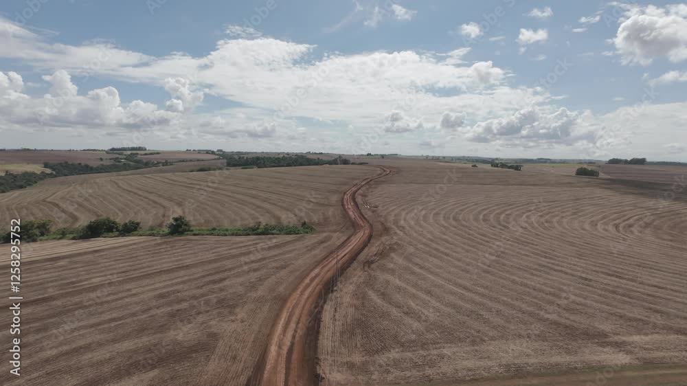 Aerial 4K LOG Drone Footage – Rural Dirt Road Surrounded by Fields – DJI Avata 2