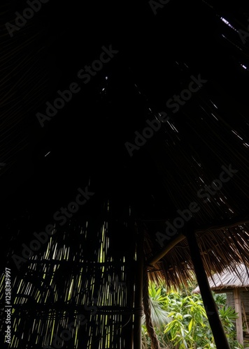 Obraz na płótnie View from the southern side of a traditional thatched roof in a rural village that thatched roof can be sunproof and rainproof and good ventilation the history of hay or old haystraw roof abstract bam w salonie