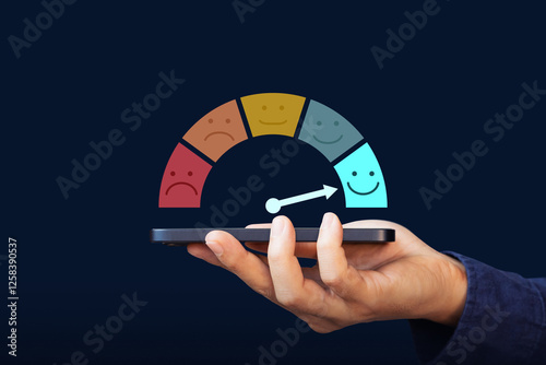 Excellent, positive feedback, service rating and satisfaction. A man holding mobile phone with rating feedback scale indicates the highest level of satisfaction with the service