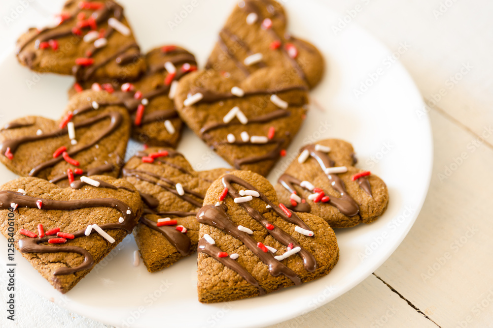 chocolate covered heart cookies on a plate chocolate covered heart cookies on a plate