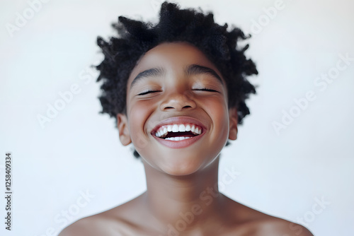 Portrait of a happy, smiling boy isolated on white background