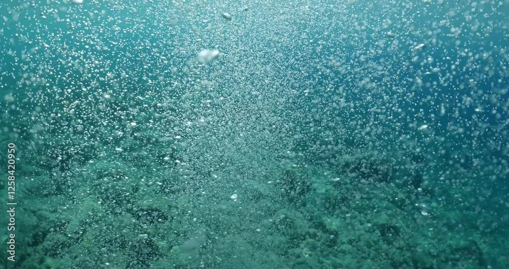 air bubbles slow  underwater coming up scenery dark blue and sun shine ocean scenery from scuba  divers background