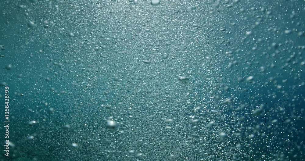air bubbles slow  underwater coming up scenery dark blue and sun shine ocean scenery from scuba  divers background