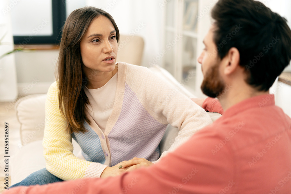 Young woman explaining something to her partner at home Young woman explaining something to her partner at home