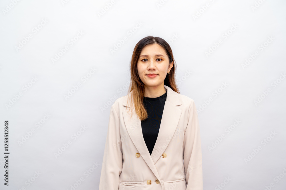 Young asian woman, professional entrepreneur standing in office clothing, looking confident, white background Young asian woman, professional entrepreneur standing in office clothing, looking confident, white background
