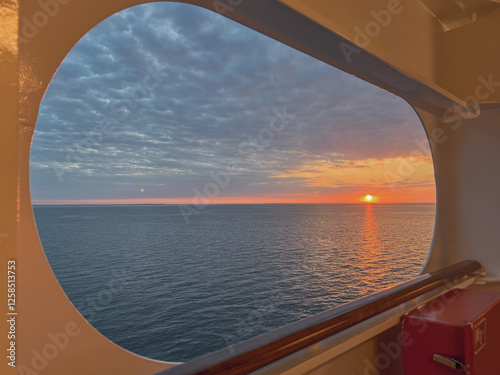 Breathtaking panoramic ocean views from outdoor balcony terrace veranda cabin stateroom of modern cruiseship cruise ship liner sailing at sea with sunset twilight blue hour clouds photo