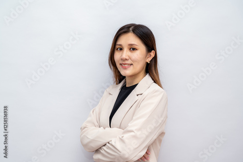 Young asian woman, professional entrepreneur standing in office clothing, looking confident, white background