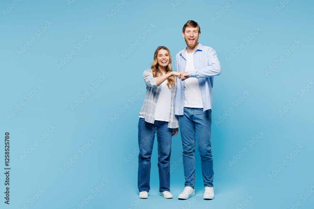 Full body young couple two friend family man woman wear shirt casual clothes together do fist bump gesture look camera isolated on pastel plain light blue background studio portrait Lifestyle concept Full body young couple two friend family man woman wear shirt casual clothes together do fist bump gesture look camera isolated on pastel plain light blue background studio portrait Lifestyle concept