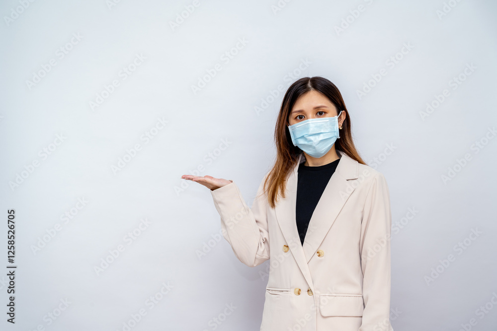 Businesswoman Wearing a Mask Pointing Somewhere Businesswoman Wearing a Mask Pointing Somewhere