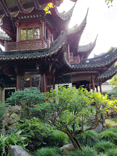 stunning traditional Chinese garden featuring intricate architecture with ornate roofs and lush greenery. serene atmosphere invites tranquility and reflection