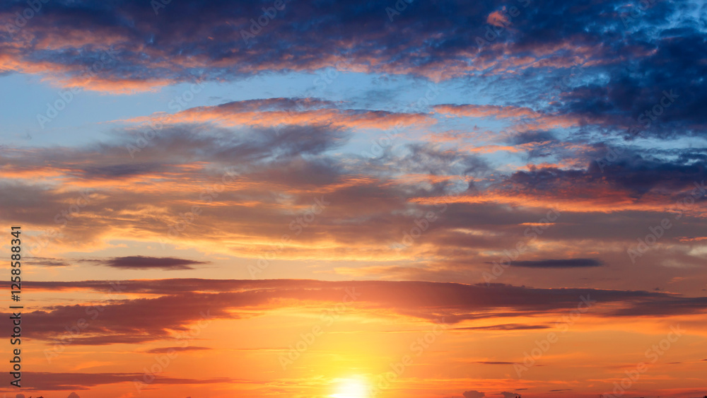 Sunset sky, Golden hour in the evening, Yellow bright sunlight on blue sky background, Horizon nature sky majestic sunshine with sun down well space picturesque sunny warm light gold color Sunset sky, Golden hour in the evening, Yellow bright sunlight on blue sky background, Horizon nature sky majestic sunshine with sun down well space picturesque sunny warm light gold color