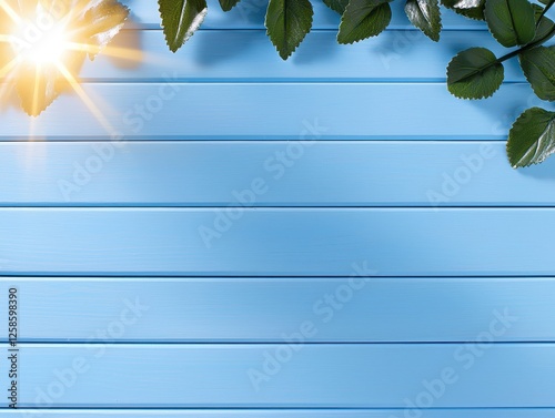 Vibrant leaves and sun rays on a blue background create a refreshing atmosphere. photo