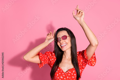 Photo of pretty young woman dance have fun wear top isolated on pink color background