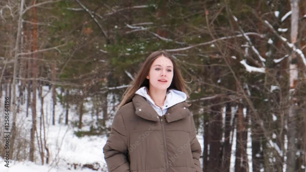 Beautiful wild young teenage woman in a hat in a frosty snowy forest, fun and youth outdoors. Beautiful wild young teenage woman in a hat in a frosty snowy forest, fun and youth outdoors.