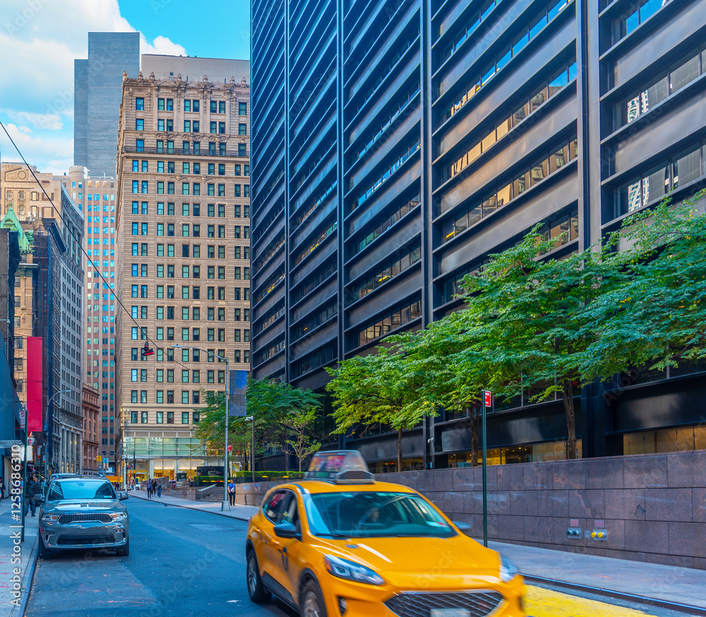Naklejka premium Taxi passing by in Lower Manhattan