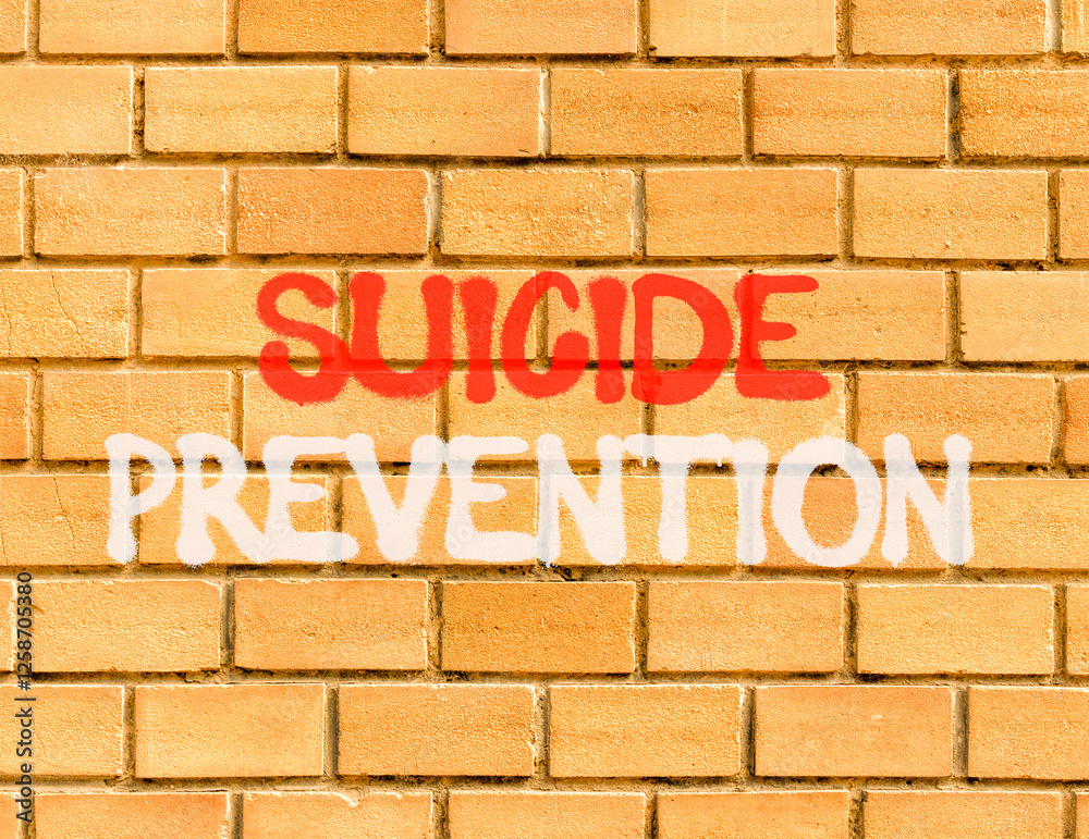 Suicide prevention symbol. Concept words Suicide prevention on beautiful brick wall. Beautiful brick wall background. Psychological and suicide prevention concept. Copy space. Suicide prevention symbol. Concept words Suicide prevention on beautiful brick wall. Beautiful brick wall background. Psychological and suicide prevention concept. Copy space.