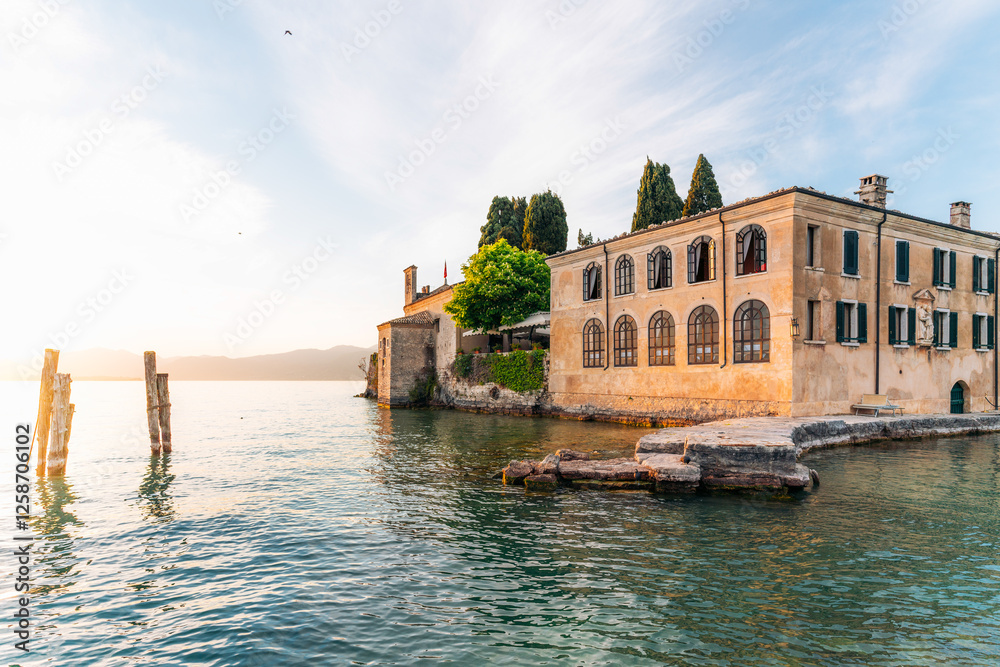 Punta San Vigilio, Garda Lake, Italy. Sunrise view of historic building.