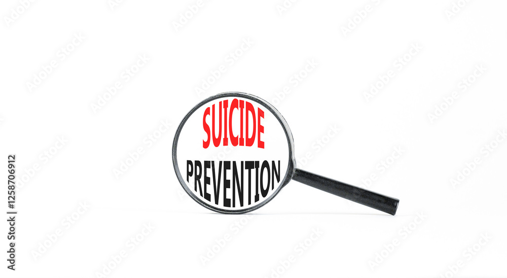 Suicide prevention symbol. Concept words Suicide prevention on beautiful magnifying glass. Beautiful white table white background. Psychological suicide prevention concept. Copy space. Suicide prevention symbol. Concept words Suicide prevention on beautiful magnifying glass. Beautiful white table white background. Psychological suicide prevention concept. Copy space.