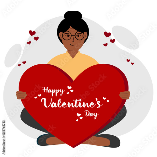 A woman holds a big red heart with congratulations on Valentine's Day.