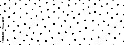 Seamless Hand Drawn vector polka dot pattern. Trendy Print with doodle tiny blots and spots. Dotted cute black and white pattern