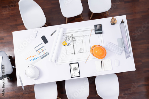 Top view empty workspace table for civil engineer and architectural construction development with paperwork and equipment for civil engineering background. Prudent photo