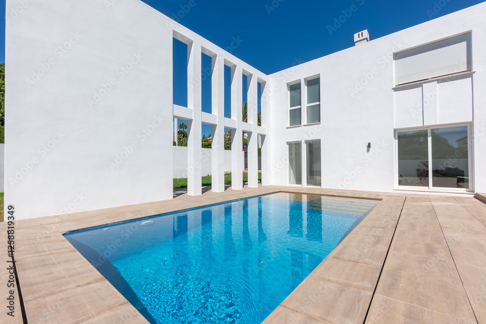 Fototapeta premium a close up image of a luxury outdoor swimming pool in the garden of a mediterranean villa for sale 