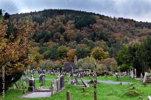 Medieval cemetery of the Glendalough monastery in the Wicklow mountains in Ireland photo