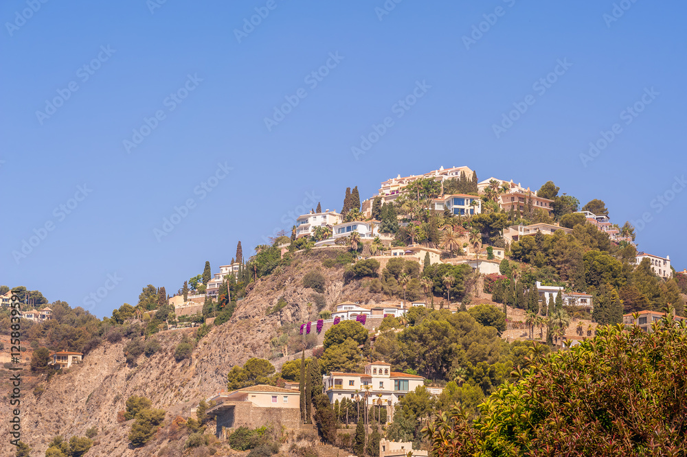 White houses on the mountain, typical Mediterranean buildings, Almuñecar, Spain White houses on the mountain, typical Mediterranean buildings, Almuñecar, Spain