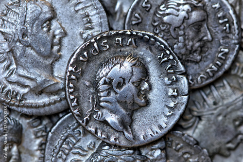 Roman silver denarius coin showing portrait of emperor Flavius Vespasianus