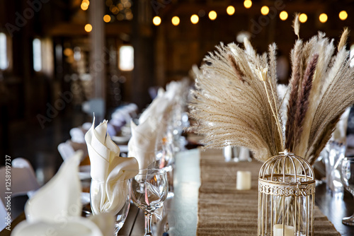 Beautiful wedding reception decorations in a rustic barn