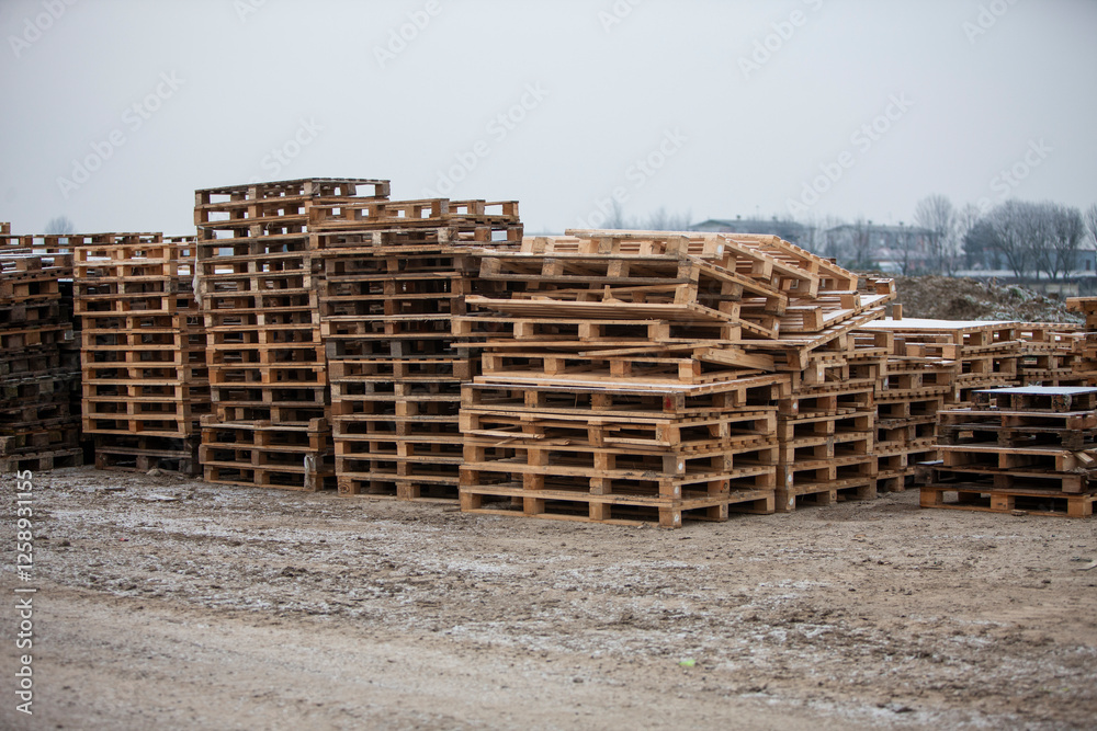 Pile of wooden pallets at a construction site Pile of wooden pallets at a construction site