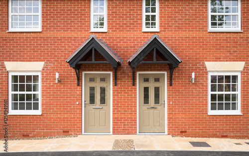 Front door of new build homes, housing development, UK