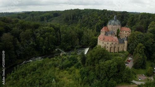 Wallpaper Mural Aerial view Kriebstein Castle, medieval fortress perched on rocky cliff above  Zschopau River in Saxony, Germany. Historic landmark showcases Germanys rich architectural heritag Torontodigital.ca