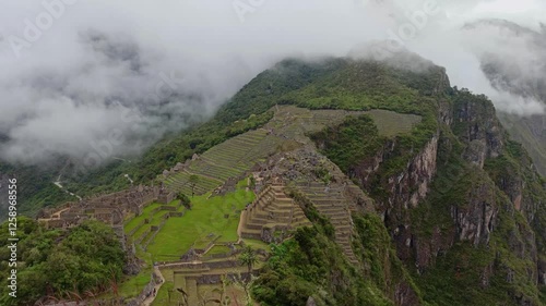 Machu Picchu ancient city view from Huchu'y Picchu in cloudy weather photo