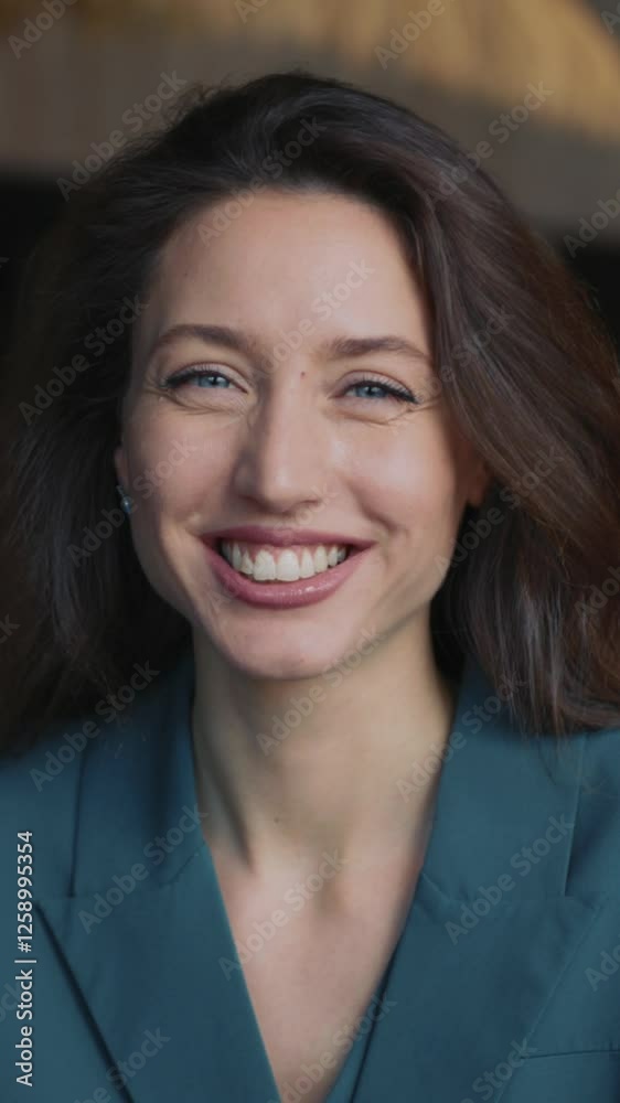 Close-up shot of smiling female manager working in cafe restaurant. Portrait of cheerful successful young woman in trendy suit looking at camera indoors. Businesswoman in formal clothes. One Close-up shot of smiling female manager working in cafe restaurant. Portrait of cheerful successful young woman in trendy suit looking at camera indoors. Businesswoman in formal clothes. One
