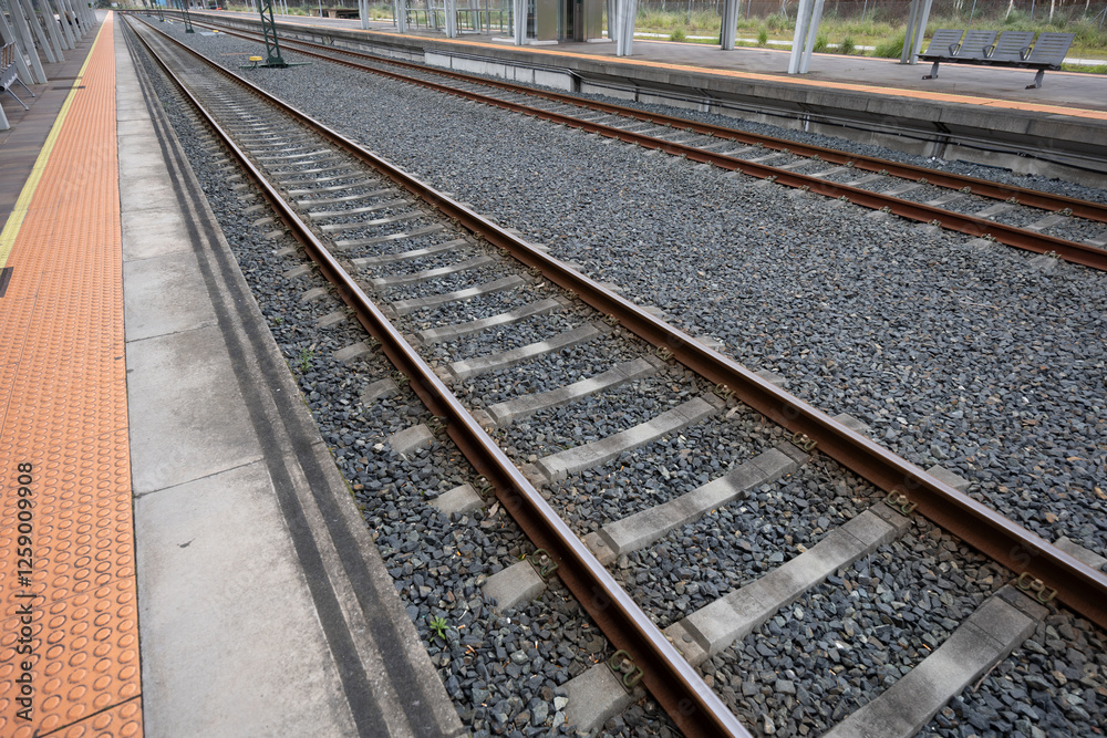 Railway Tracks at a Modern Station Setting Railway Tracks at a Modern Station Setting