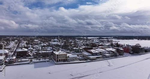 Clayton, NY, USA - 02-09-2025:  Winter aerial video Clayton, NY along a frozen St Lawrence River
