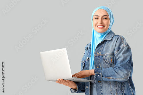 Stylish Muslim woman using ...