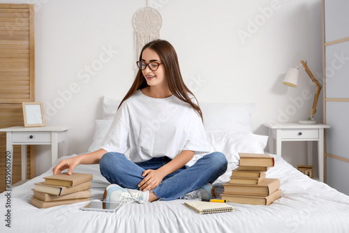 Happy female student with t...