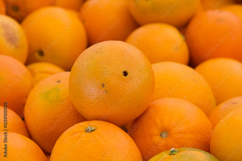 Close up on navel oranges for sale at Farmers Market Close up on navel oranges for sale at Farmers Market